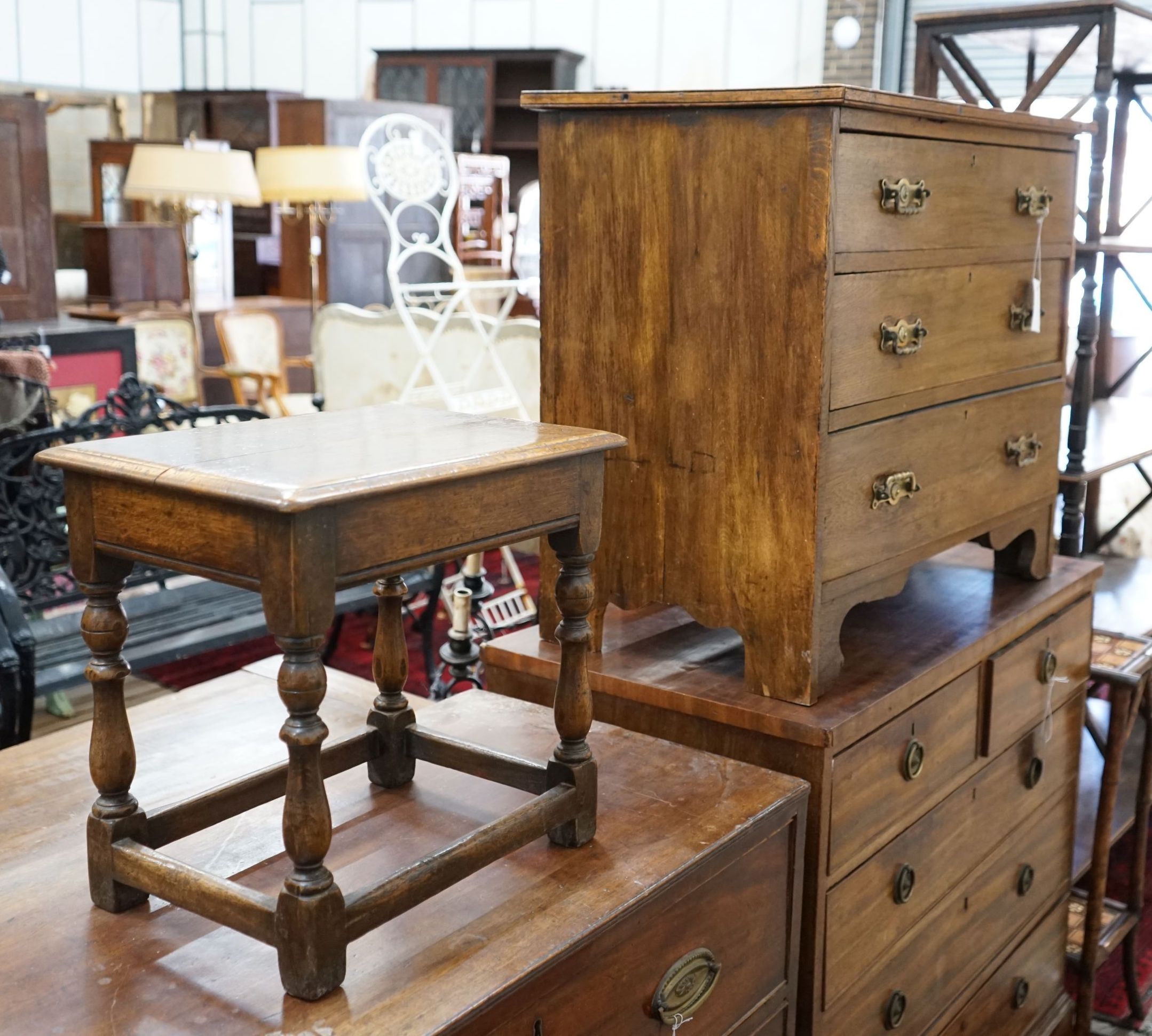 An early 20th century oak three drawer chest, width 77cm, depth 43cm, height 67cm together with an 18th century style oak joint stool